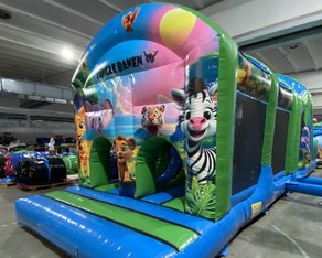 Eight shirts arranged on table in black, olive, grey, blue, white, red, mustard, and green.